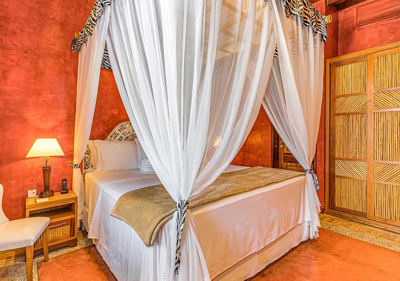 Dpny Beach Hotel & Spa איליה-בלה מראה חיצוני תמונה A bed with a mosquito net